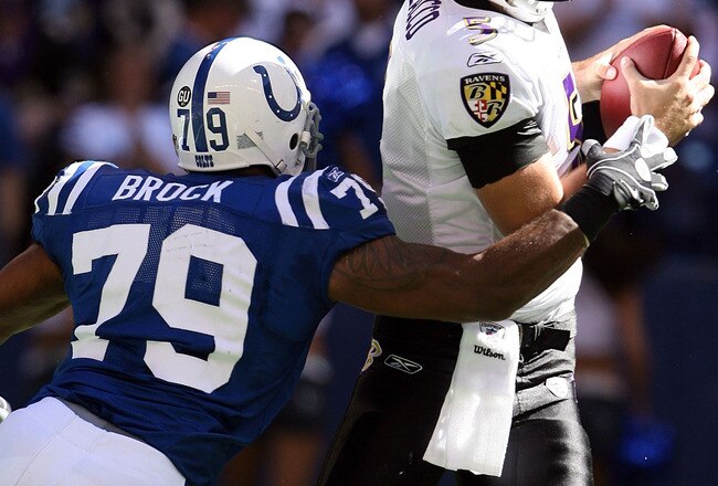 INDIANAPOLIS - OCTOBER 12:  Joe Flacco #5 of the Baltimore Ravens is sacked by Raheem Brock #79 of the Indianapolis Colts during the NFL game at Lucas Oil Stadium on October 12, 2008 in Indianapolis, Indiana.  The Colts won 31-3.  (Photo by Andy Lyons/Getty Images)