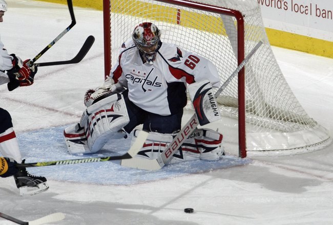 BUFFALO, NY - MARCH 3:  Jose Theodore #60 of the Washington Capitals defends the net during the game against the Buffalo Sabres at HSBC Arena on March 3, 2010 in Buffalo, New York. (Photo by Rick Stewart/Getty Images)