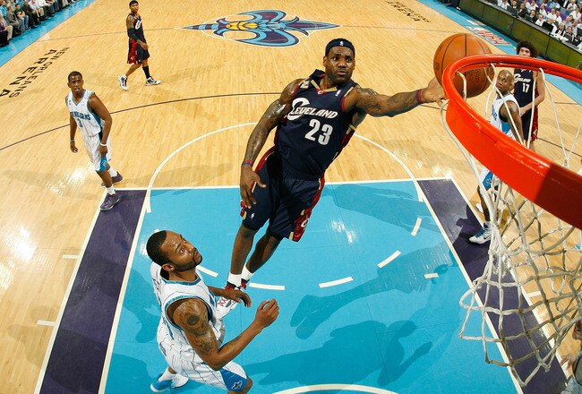 NEW ORLEANS - MARCH 24:  LeBron James #23 of the Cleveland Cavaliers shoots the ball over Morris Peterson #24 of the New Orleans Hornets at the New Orleans Arena on March 24, 2010 in New Orleans, Louisiana.  The Cavaliers defeated the Hornets 105-92.  NOTE TO USER: User expressly acknowledges and agrees that, by downloading and/or using this Photograph, User is consenting to the terms and conditions of the Getty Images License Agreement.  (Photo by Chris Graythen/Getty Images)