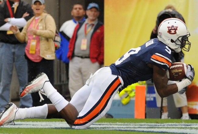 TAMPA, FL - JANUARY 1: QWide receiver Quindarius Carr #9 of the Auburn Tigers dives for a touchdown against the Northwestern Wildcats in the Outback Bowl January 1, 2010 at Raymond James Stadium in Tampa, Florida.  (Photo by Al Messerschmidt/Getty Images)
