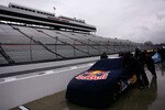 MARTINSVILLE, VA - MARCH 26:  Crew members push the #83 Red Bull Toyota off pit road after qualifying was cancelled for the NASCAR Sprint Cup Series Goody's Fast Pain Relief 500 at Martinsville Speedway due to rain on March 26, 2010 in Martinsville, Virginia.  (Photo by Jason Smith/Getty Images for NASCAR)