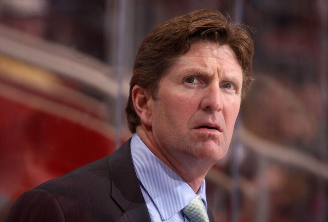 GLENDALE, AZ - OCTOBER 22:  Head coach Mike Babcock of the Detroit Red Wings watches from the bench during the NHL game against the Phoenix Coyotes at Jobing.com Arena on October 22, 2009 in Glendale, Arizona. The Coyotes defeated the Red Wings 3-2 in overtime.  (Photo by Christian Petersen/Getty Images)