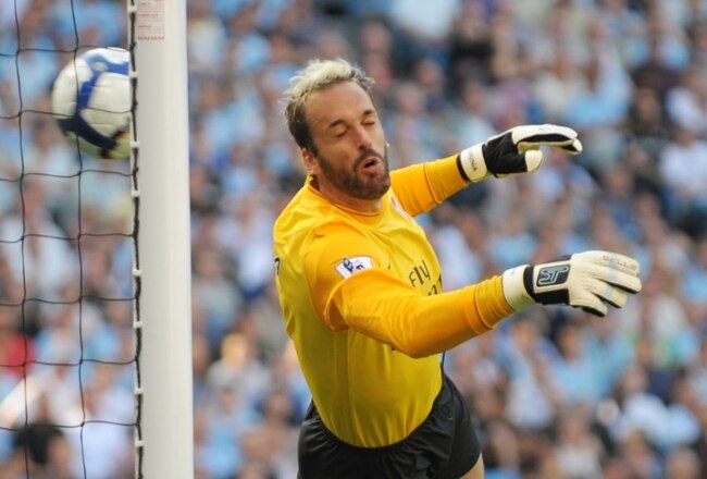 MANCHESTER, ENGLAND - SEPTEMBER 12:   Manuel Almunia of Arsenal concedes an own goal as he heads the ball into his own net after it rebounded off the post and hit him during the Barclays Premier League match between Manchester City and Arsenal at the City of Manchester Stadium on September 12, 2009 in Manchester, England. (Photo by Shaun Botterill/Getty Images)