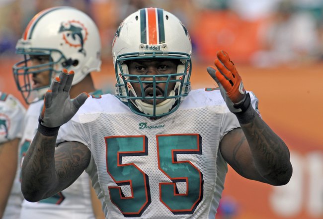 MIAMI, FL - JANUARY 4:  Linebacker Joey Porter #55 of the Miami Dolphins sets on defense against the Baltimore Ravens in an NFL Wildcard Playoff Game at Dolphins Stadium on January 4, 2009 in Miami, Florida.  (Photo by Al Messerschmidt/Getty Images) 