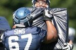 KIRKLAND, WA - JULY 31:  Guard Steve Vallos #69 of the Seattle Seahawks holds a pad in a blocking drill against Rob Sims #67 in training camp on July 31, 2007 at Seahawks Headquarters in Kirkland, Washington.  (Photo by Otto Greule Jr/Getty Images)