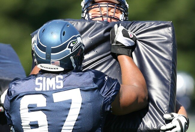 KIRKLAND, WA - JULY 31:  Guard Steve Vallos #69 of the Seattle Seahawks holds a pad in a blocking drill against Rob Sims #67 in training camp on July 31, 2007 at Seahawks Headquarters in Kirkland, Washington.  (Photo by Otto Greule Jr/Getty Images)
