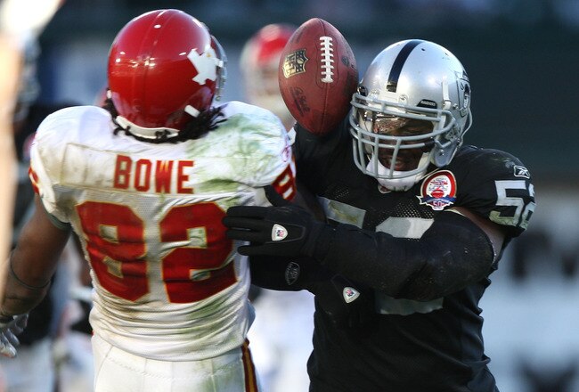 OAKLAND, CA - NOVEMBER 15:  Dwayne Bowe #82 of the Kansas City Chiefs fumbles the ball after being hit by Kirk Morrison #52 of the Oakland Raiders during an NFL game  at Oakland-Alameda County Coliseum on November 15, 2009 in Oakland, California. (Photo by Jed Jacobsohn/Getty Images)