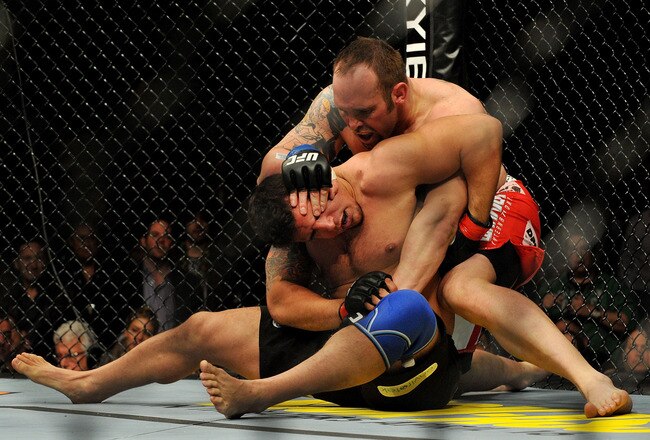 NEWARK, NJ - MARCH 27:  UFC fighter Shane Carwin (R) battles against Frank Mir (L) during their 'Interim' Heavyweight title bout at UFC 111 at the Prudential Center on March 27, 2010 in Newark, New Jersey. Carwin won by Technical Knock Out (Strikes) at 3:48 in the 1st round.  (Photo by Jon Kopaloff/Getty Images)
