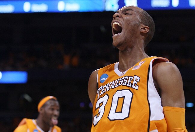 ST. LOUIS - MARCH 28:  J.P. Prince #30 of the Tennessee Volunteers celebrates his dunk against the Michigan State Spartans as teammate Wayne Chism #4 celebrates during the midwest regional final of the 2010 NCAA men's basketball tournament at the Edward Jones Dome on March 28, 2010 in St. Louis, Missouri.  (Photo by Elsa/Getty Images)