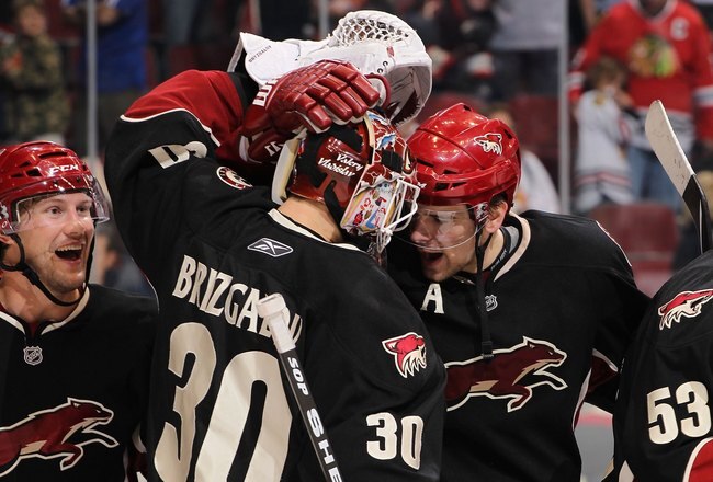 GLENDALE, AZ - MARCH 20:  Shane Doan #19, Ilya Bryzgalov#30 and Zbynek Michalek #4 of the Phoenix Coyotes celebrate after winning the NHL game against the Chicago Blackhawks at Jobing.com Arena on March 20, 2010 in Glendale, Arizona. The Coyotes defeated the Blackhawks 5-4 in an overtime shootout.  (Photo by Christian Petersen/Getty Images)