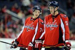 WASHINGTON - MARCH 28:  John Carlson #74 and Jeff Schultz #55 of the Washington Capitals warm up before the game against the Calgary Flames on March 28, 2010 in Washington, DC.  (Photo by Greg Fiume/Getty Images)