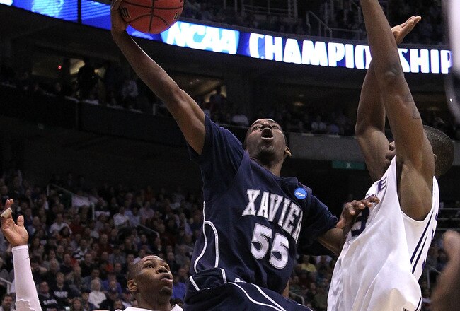 SALT LAKE CITY - MARCH 25: Jordan Crawford #55 of the Xavier Musketeers shoots over Dominique Sutton #23 of the Kansas State Wildcats during the third round of the 2010 NCAA men�s basketball tournament at the Energy Solutions Arena on March 25, 2010 in Salt Lake City, Utah.  (Photo by Jed Jacobsohn/Getty Images)