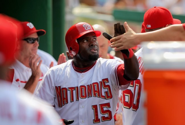WASHINGTON - AUGUST 06:  Cristian Guzman #15 of the Washington Nationals celebrates in the dugout after scoring against the Florida Marlins at Nationals Park on August 6, 2009 in Washington, DC. The Nationals defeated the Marlins 12-8.  (Photo by Doug Pensinger/Getty Images)