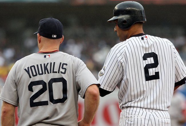 NEW YORK - SEPTEMBER 27:  Derek Jeter #2 of the New York Yankees and Kevin Youkilis #20 of the Boston Red Sox look on on September 27, 2009 at Yankee Stadium in the Bronx borough of New York City.  (Photo by Jim McIsaac/Getty Images)
