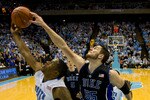 CHAPEL HILL, NC - FEBRUARY 10: Duke center Brian Zoubek #55 works for a rebound against North Carolina forward Deon Thompson #21 during a men's college basketball game at Dean Smith Center on February 10, 2010 in Chapel Hill, North Carolina. (Photo by Chris Keane/Getty Images)
