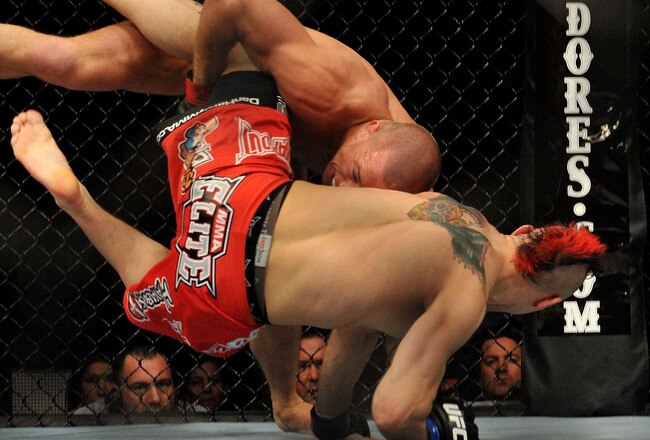 NEWARK, NJ - MARCH 27:  UFC fighter Georges St-Pierre (top) battles Dan Hardy during their Welterweight title bout at UFC 111 at the Prudential Center on March 27, 2010 in Newark, New Jersey.  St-Pierre won by Unanimous Decision at 5:00 of the 5th round.  (Photo by Jon Kopaloff/Getty Images)