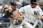 NEW YORK - SEPTEMBER 27:  Kevin Youkilis #20 of the Boston Red Sox throws out Brett Gardner #11 of the New York Yankees on September 27, 2009 at Yankee Stadium in the Bronx borough of New York City.  (Photo by Jim McIsaac/Getty Images)