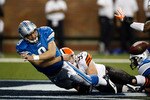 DETROIT, MI - NOVEMBER 22: Matthew Stafford #9 of the Detroit Lions tries to pass the football before being sacked in the end zone against Jason Trusnik #93 the Cleveland Browns at Ford Field on November 22, 2009 in Detroit, Michigan. Stafford was called for intentional grounding resulting in a safety for the Browns. The Lions came from behind to defeat the Browns 38-37. (Photo by Joe Robbins/Getty Images)