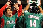 MEXICO CITY - MARCH 11:  Scott Hairston #14 of Mexico is congratulated by teammates after hitting a two-run home run against Australia  during the 2009 World Baseball Classic Pool B match on March 11, 2009 at the Estadio Foro Sol in Mexico City, Mexico.  (Photo by Kevork Djansezian/Getty Images)