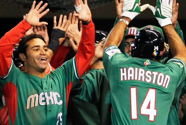 MEXICO CITY - MARCH 11:  Scott Hairston #14 of Mexico is congratulated by teammates after hitting a two-run home run against Australia  during the 2009 World Baseball Classic Pool B match on March 11, 2009 at the Estadio Foro Sol in Mexico City, Mexico.  (Photo by Kevork Djansezian/Getty Images)