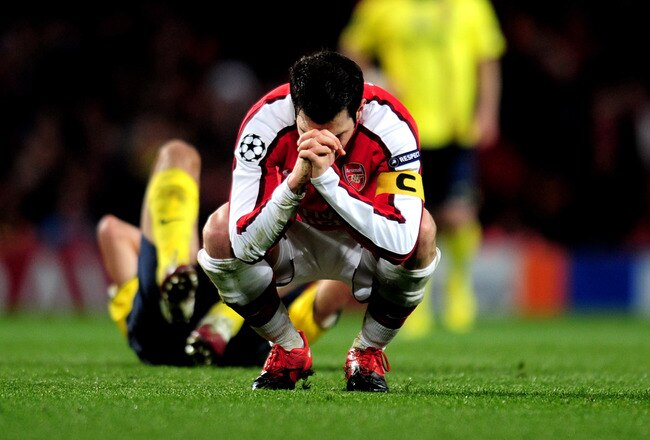 LONDON, ENGLAND - MARCH 31:  Cesc Fabregas of Arsenal reacts after being shown a yellow card by referee Massimo Busacca of Switerland during the UEFA Champions League quarter final first leg match between Arsenal and FC Barcelona at the Emirates Stadium on March 31, 2010 in London, England. Cesc Fabregas of Arsenal will now miss the next match at the Camp Nou in Barcelona.  (Photo by Shaun Botterill/Getty Images)