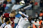 RAMENSKOE, RUSSIA - NOVEMBER 02: Benoit Angbwa (R) and Zelao of FC Saturn Moscow Oblast compete for the ball with Aleksandr Bukharov of FC Rubin Kazan during the Russian Football League Championship match between FC Saturn and FC Rubin, at the Saturn Stadium on November 02, 2008 in Ramenskoe, outside Moscow, Russia.  (Photo by Dima Korotayev/Epsilon/Getty Images)