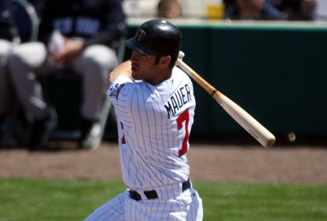 FORT MYERS, FL - MARCH 07:  Joe Mauer #7 of the Minnesota Twins hits against the New York Yankees at Lee County Sports Complex  on March 7, 2010 in Fort Myers, Florida.  (Photo by Marc Serota/Getty Images)