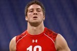 INDIANAPOLIS, IN - FEBRUARY 28: Quarterback Tim Tebow of Florida runs the 40 yard dash during the NFL Scouting Combine presented by Under Armour at Lucas Oil Stadium on February 28, 2010 in Indianapolis, Indiana. (Photo by Scott Boehm/Getty Images)