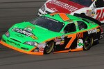 LAS VEGAS - FEBRUARY 27: Danica Patrick, driver of the #7 GoDaddy.com Chevrolet, races Shelby Howard, driver of the #70 ForeTravel Motorcoach Chevrolet, during the NASCAR Nationwide Series Sam's Town 300 at Las Vegas Motor Speedway on February 27, 2010 in Las Vegas, Nevada.  (Photo by Stephen Dunn/Getty Images for NASCAR)
