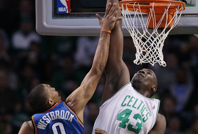 BOSTON - MARCH 31:  Kendrick Perkins #43 of the Boston Celtics tries to block a shot by Russell Westbrook #0 of the Oklahoma City Thunder on March 31, 2010 at the TD Garden in Boston, Massachusetts.  NOTE TO USER: User expressly acknowledges and agrees that, by downloading and or using this photograph, User is consenting to the terms and conditions of the Getty Images License Agreement.  (Photo by Elsa/Getty Images)