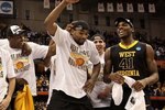SYRACUSE, NY - MARCH 27:  Da'Sean Butler #1 of the West Virginia Mountaineers dances as he celebrates with his teammates after West Virginia won 73-66 against the Kentucky Wildcats during the east regional final of the 2010 NCAA men's basketball tournament at the Carrier Dome on March 27, 2010 in Syracuse, New York.  (Photo by Jim McIsaac/Getty Images)