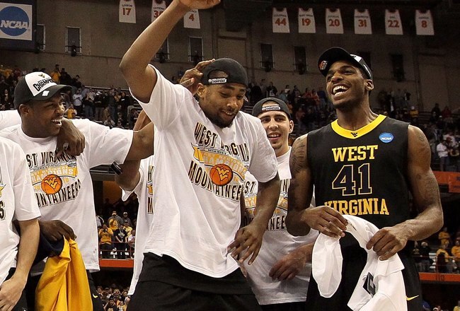 SYRACUSE, NY - MARCH 27:  Da'Sean Butler #1 of the West Virginia Mountaineers dances as he celebrates with his teammates after West Virginia won 73-66 against the Kentucky Wildcats during the east regional final of the 2010 NCAA men's basketball tournament at the Carrier Dome on March 27, 2010 in Syracuse, New York.  (Photo by Jim McIsaac/Getty Images)