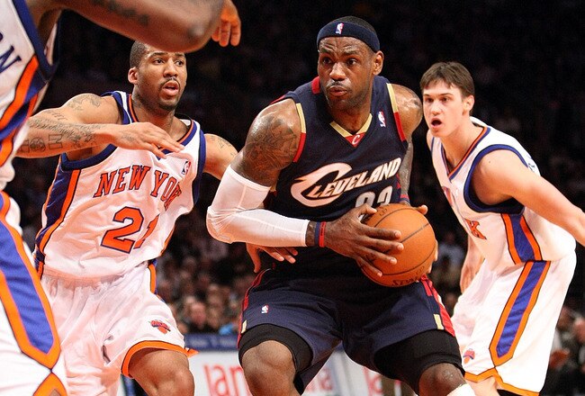 NEW YORK - FEBRUARY 04:  LeBron James #23 of the Cleveland Cavaliers drives the ball to the basket against Wilson Chandler #21 of the New York Knicks on February 4, 2009 at Madison Square Garden in New York City. NOTE TO USER: User expressly acknowledges and agrees that, by downloading and or using this photograph, User is consenting to the terms and conditions of the Getty Images License Agreement.  (Photo by Nick Laham/Getty Images)