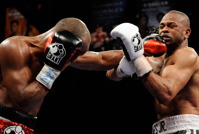 LAS VEGAS - APRIL 03:  Bernard Hopkins (L) hits Roy Jones Jr. during the 12th round of their light heavyweight bout at the Mandalay Bay Events Center April 3, 2010 in Las Vegas, Nevada. Hopkins won by unanimous decision.  (Photo by Ethan Miller/Getty Images)
