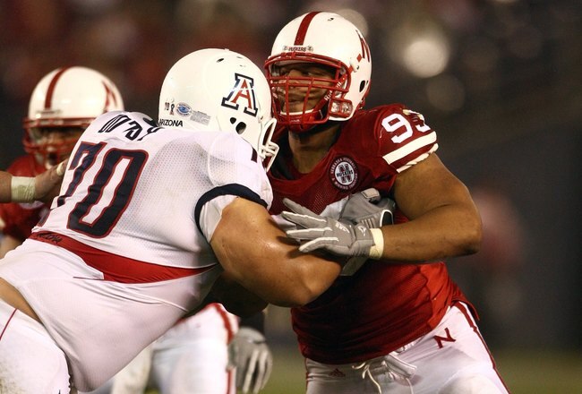 SAN DIEGO - DECEMBER 30:  Ndamukong Suh #93 of the University of Nebraska Cornhuskers engages an offensive lineman in a block during the Pacific Life Holiday Bowl against University of Arizona Wildcats on December 30, 2009 at Qualcomm Stadium in San Diego, California. The Cornhuskers defeated the Wildcats 33-0. (Photo By Donald Miralle/Getty Images)