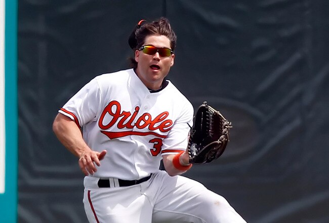 SARASOTA, FL - APRIL 03:  Outfielder Luke Scott #30 of the Baltimore Orioles catches a fly ball against the New York Mets during a Grapefruit League Spring Training Game at Ed Smith Stadium on April 3, 2010 in Sarasota, Florida.  (Photo by J. Meric/Getty Images)