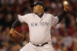 BOSTON - APRIL 04:  CC Sabathia #52 of the New York Yankees deliver a pitch against the Boston Red Sox on April 4, 2010 during Opening Night at Fenway Park in Boston, Massachusetts.  (Photo by Elsa/Getty Images)