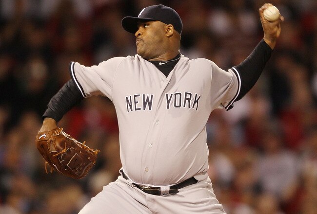 BOSTON - APRIL 04:  CC Sabathia #52 of the New York Yankees deliver a pitch against the Boston Red Sox on April 4, 2010 during Opening Night at Fenway Park in Boston, Massachusetts.  (Photo by Elsa/Getty Images)