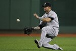 BOSTON - AUGUST 23:  Nick Swisher #33 of the New York Yankees makes the catch for the last out in the eighth inning against the Boston Red Sox on August 23, 2009 at Fenway Park in Boston, Massachusetts.  (Photo by Elsa/Getty Images)