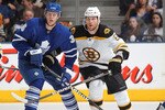 TORONTO, ON - APRIL 3: Dennis Wideman #6 of the Boston Bruins ties up Carl Gunnarsson #36 of the Toronto Maple Leafs in a game on April 3, 2010 at the Air Canada Centre in Toronto, Ontario. (Photo by Claus Andersen/Getty Images)