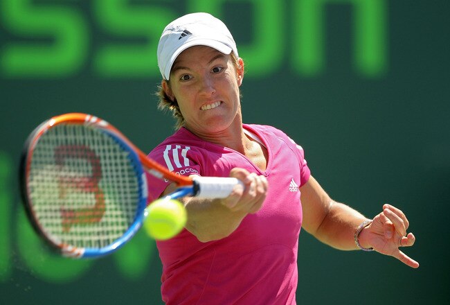 KEY BISCAYNE, FL - MARCH 31:  Justine Henin of Belgium returns a shot against Caroline Wozniacki of Denmark during day nine of the 2010 Sony Ericsson Open at Crandon Park Tennis Center on March 31, 2010 in Key Biscayne, Florida.  (Photo by Al Bello/Getty Images)