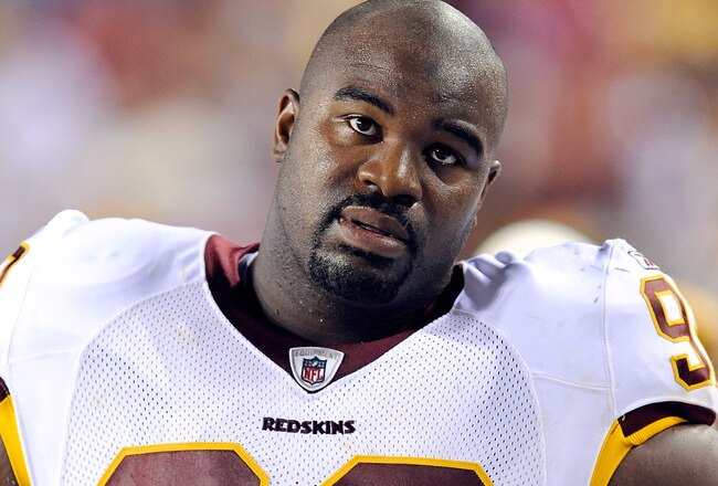 LANDOVER, MD - AUGUST 22:  Albert Haynesworth #92 of the Washington Redskins watches the game against the Pittsburgh Steelers at Fed Ex Field on August 22, 2009 in Landover, Maryland.  (Photo by Greg Fiume/Getty Images)