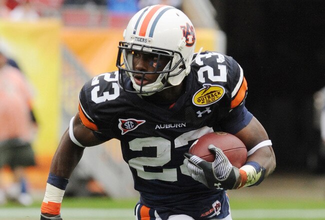 TAMPA, FL - JANUARY 1: Running back Onterio McCalebb #23 of the Auburn Tigers rushes upfield against the Northwestern Wildcats in the Outback Bowl January 1, 2010 at Raymond James Stadium in Tampa, Florida.  (Photo by Al Messerschmidt/Getty Images)