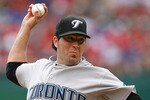 ARLINGTON, TX - APRIL 05:  Starting pitcher Shaun Marcum #28 throws against the Texas Rangers on Opening Day at Rangers Ballpark on April 5, 2010 in Arlington, Texas. (Photo by Tom Pennington/Getty Images)