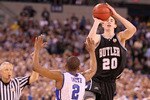 INDIANAPOLIS - APRIL 05:  Gordon Hayward #20 of the Butler Bulldogs shoots a last second shot from half court over Nolan Smith #2 of the Duke Blue Devils that missed during the 2010 NCAA Division I Men's Basketball National Championship game at Lucas Oil Stadium on April 5, 2010 in Indianapolis, Indiana. Duke defeated Butler 61-59 to win the championship. (Photo by Andy Lyons/Getty Images)