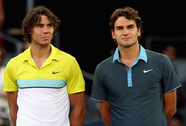 MADRID, SPAIN - MAY 17:  Roger Federer of Switzerland (R) and Rafael Nadal of Spain during the prize giving ceremony after the mens final during the Madrid Open tennis tournament at the Caja Magica on May 17, 2009 in Madrid, Spain.  (Photo by Clive Brunskill/Getty Images)
