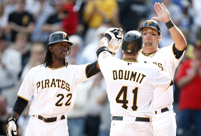 PITTSBURGH - APRIL 05: Ryan Doumit #41 of the Pittsburgh Pirates celebrates his eighth inning home run with Andrew McCutchen #22 and Garrett Jones #46 while playing the Los Angeles Dodgers during the Home Opener for the Pittsburgh Pirates on April 5, 2010 at PNC Park in Pittsburgh, Pennsylvania. Pittsburgh won the game 11-5.  (Photo by Gregory Shamus/Getty Images)