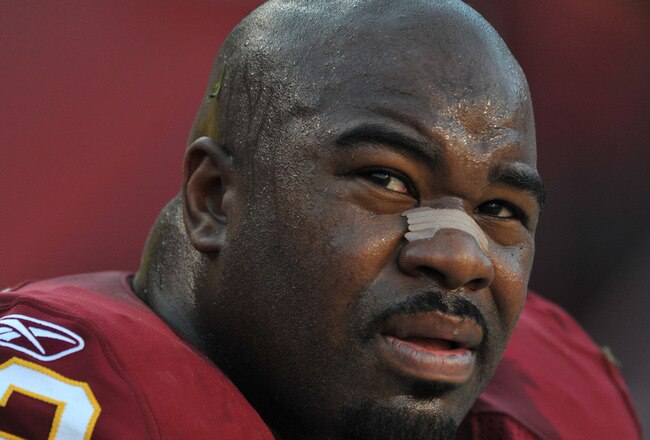 LANDOVER, MD - NOVEMBER 15:  Albert Haynesworth #92 of the Washington Redskins sits on the sidelines during the game against the Denver Broncos at FedExField on November 15, 2009 in Landover, Maryland. The Redskins defeated the Broncos 27-17. (Photo by Larry French/Getty Images)