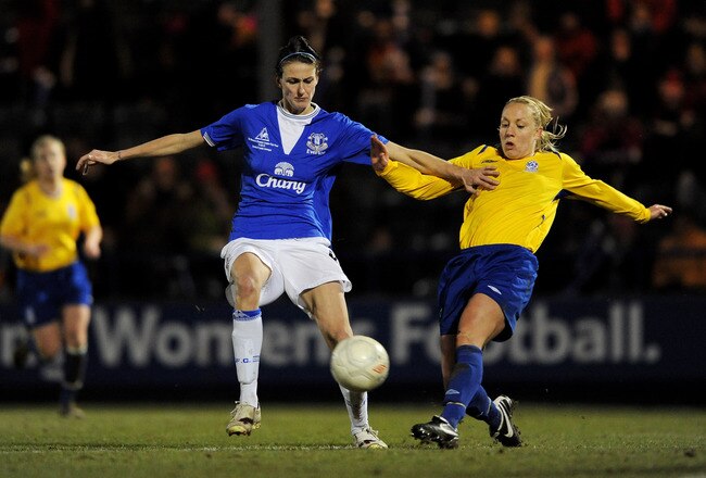 ROCHDALE, ENGLAND - FEBRUARY 11:  Katie Holtham of Leeds challenges Jill Scott of Everton during the FA Tesco Women�s Premier League Cup Final between Everton and Leeds Carnegie at Spotland Stadium on February 11, 2010 in Rochdale, England.  (Photo by Michael Regan/Getty Images)