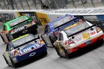 BRISTOL, TN - MARCH 21:  Mark Martin, driver of the #5 GoDaddy.com Chevrolet, leads Jimmie Johnson, driver of the #48 Lowe's Chevrolet, Kevin Conway, driver of the #37 Extenze Ford, and Greg Biffle, driver of the #16 US Census Ford,during the NASCAR Sprint Cup Series Food City 500 at Bristol Motor Speedway on March 21, 2010 in Bristol, Tennessee.  (Photo by Doug Pensinger/Getty Images)